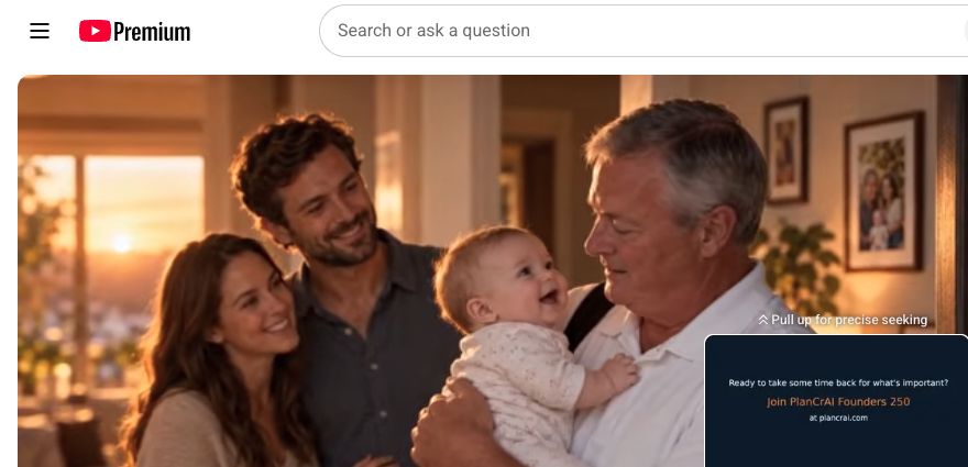 Tony holding a smiling baby with family beside him